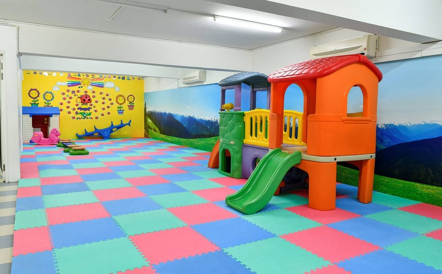 Play area with a slide